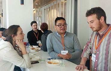 Mike Galang (second from the right) talks to other attendees at OpenCon 2016.