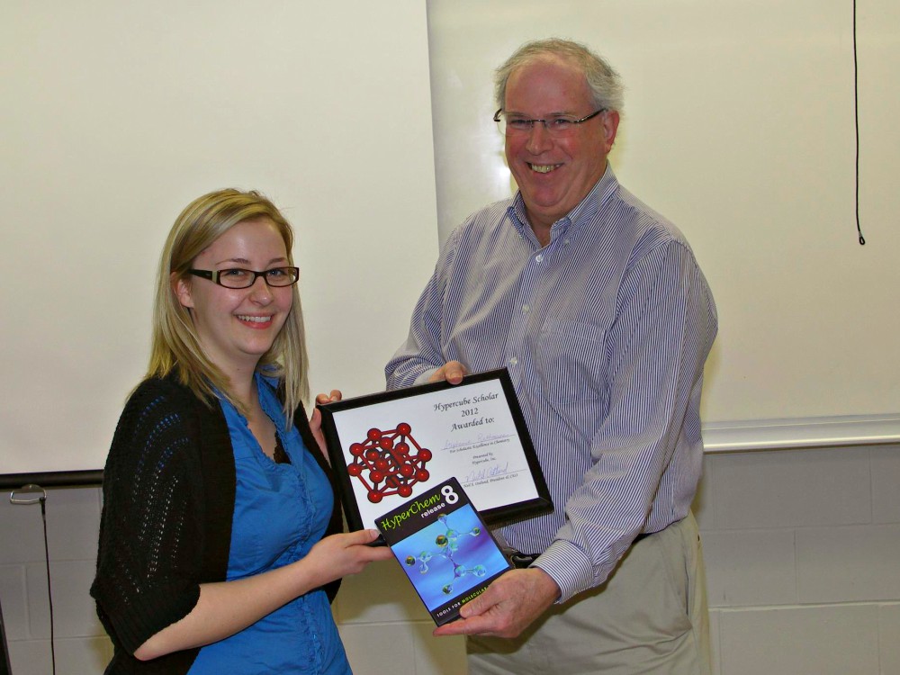 Brian McCarry presents Stephanie Rathmann with the Hyperchem Scholar Award for her undergraduate thesis.