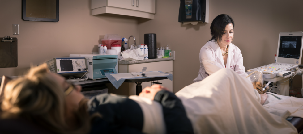 Radiologist Dr. Meg Chiavaras treats Kim Hotrum's foot at the David Braley sport medicine clinic. 