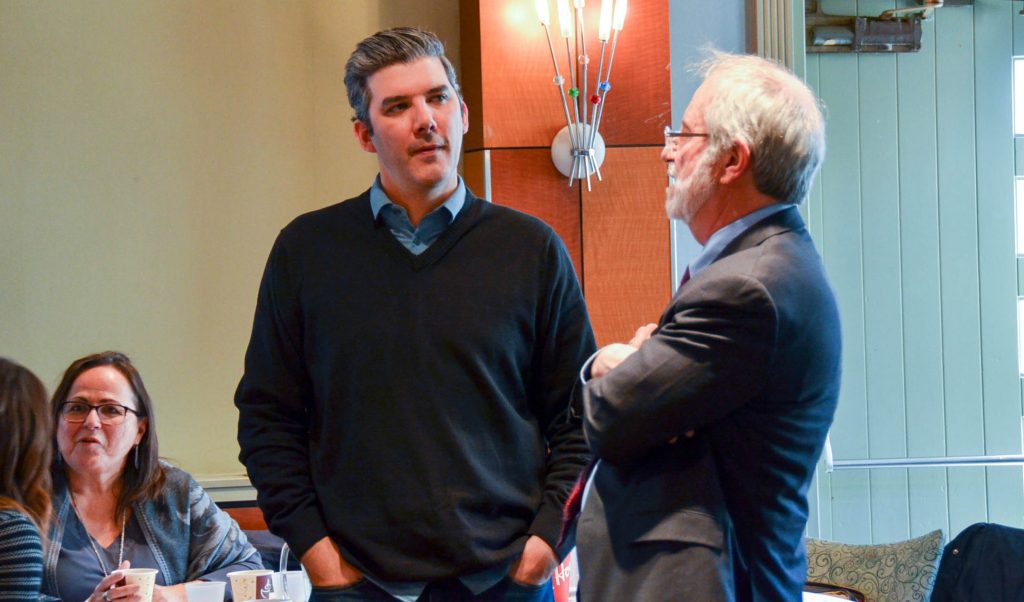 Hayden King, director of the Ryerson Centre for Indigenous Governance, left, speaks to McMaster University President Patrick Deane at the MIRI Symposium in March 2018