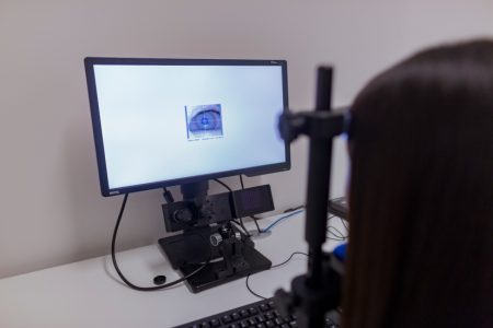 Student using eye-tracking computer in McMaster lab