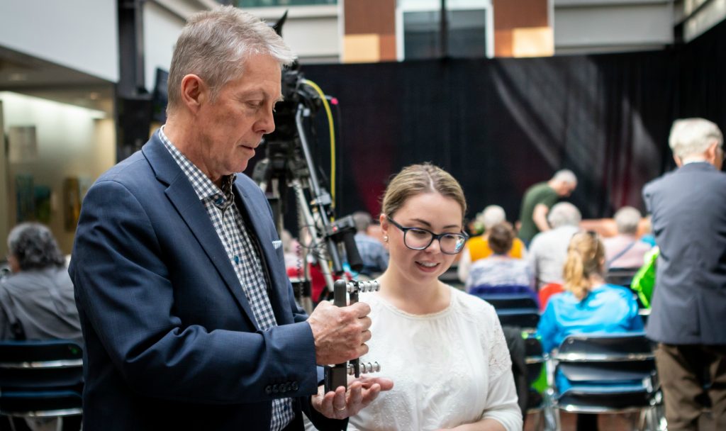 Hamilton Mayor Fred Eisenberger tests his grip strength before a MIRA panel discussion on how Smart Cities can support an aging population.