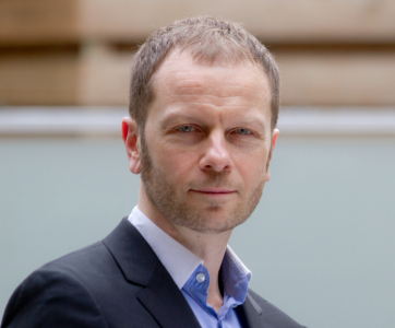 Headshot of a man looking at the camera