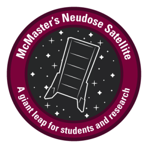 A white stylized outline of McMaster’s NEUDOSE satellite set against a black background encase in a maroon circle. Within the maroon circle there is text that reads, ‘McMaster’s Neudose Satellite a giant leap for students and research.’ 