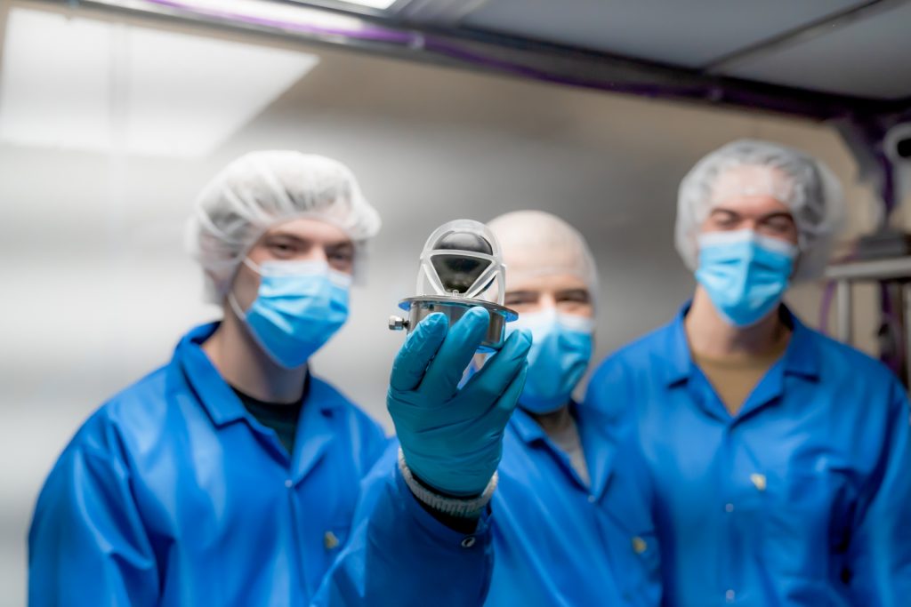 Researcher Andrei Hanu holds the NEUDOSE payload.