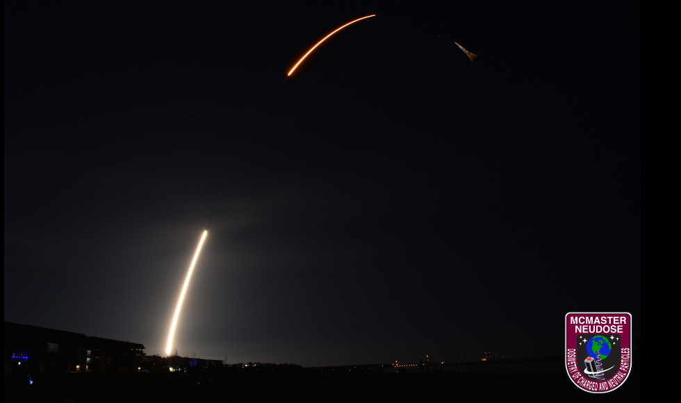 A SpaceX Falcon 9 rocket blasting off into the night sky