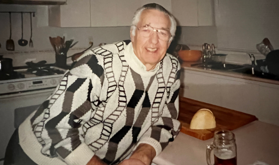 Image of Amanda Cooke's grandpa leaning on his kitchen counter.