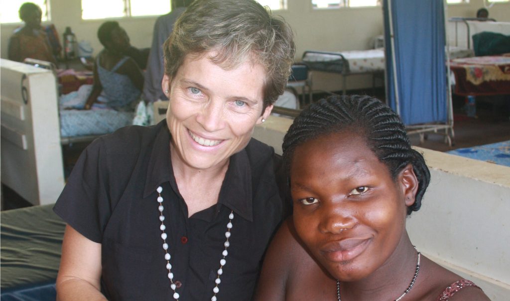 Dr. Jean Chamberlain Froese, seen here with a mother and baby in Kawolo General Hospital in Uganda