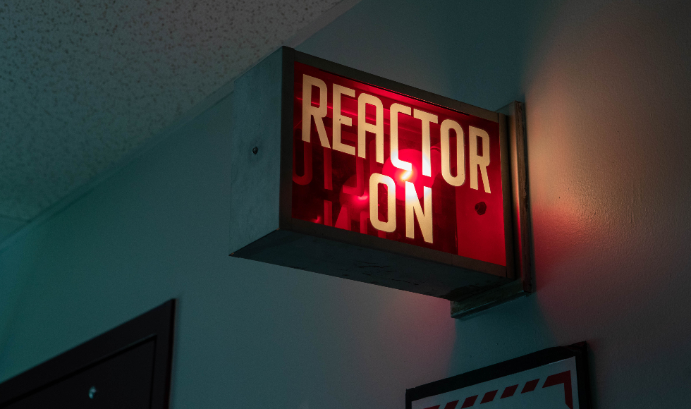 A lit-up sign that reads 'Reactor on'