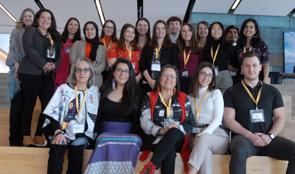 Group photo of about 20 people smiling.