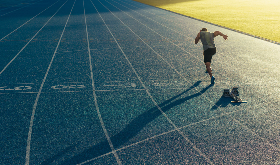Photo of lone runner on an outdoor track