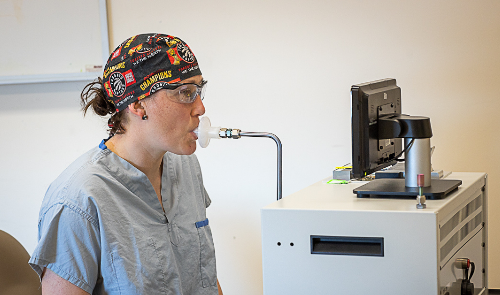 Hamilton Health Sciences ICU respiratory therapist Jennifer LeRoux demonstrates how to capture a breath sample in the Picamole machine.