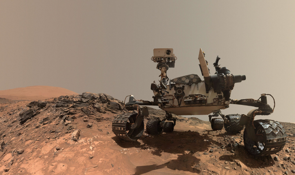 The Curiosity Rover on a rocky landscape