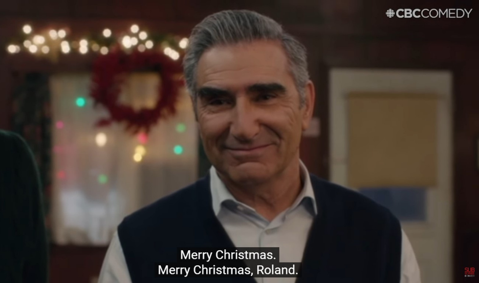 A screenshot from Schitts Creek showing Eugene Levy's character smiling and subtitles that read: 