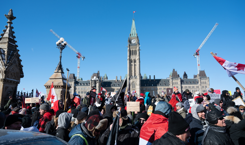 A photo of protesters gathered in front of Parliament Hill in Ottawa