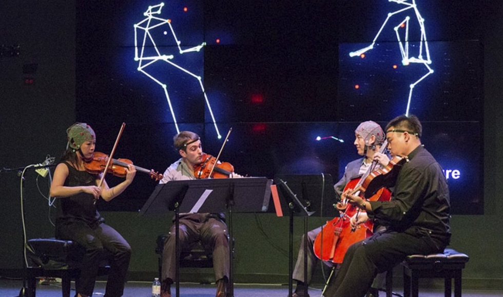 A string quartet hooked up to motion capture technology performs at the LIVELab