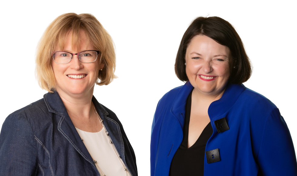 Two women wearing. blue blazers smile at camera. combined photo of two headshots