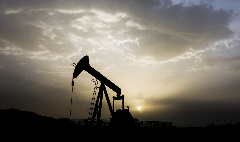 A single oil pumpjack in an oil field