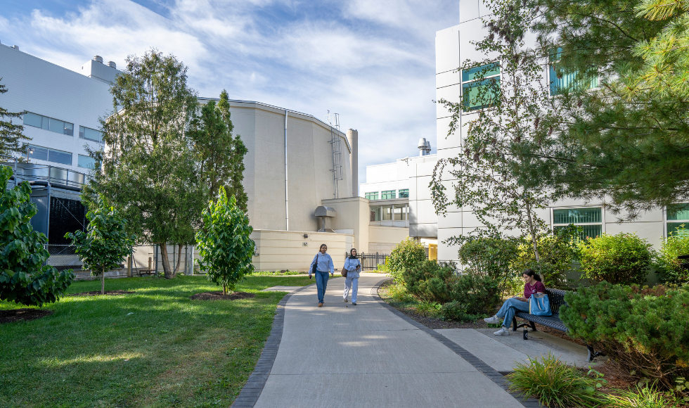 Students walking on the path outside the nuclear reactor