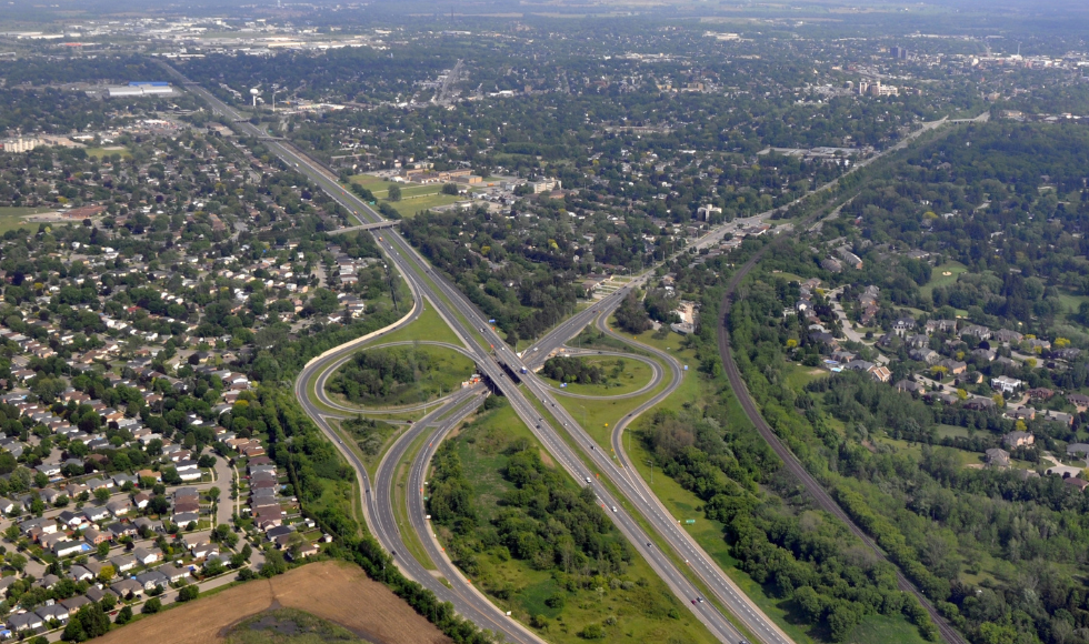 Aerial view of two highways intersecting with overpasses and on ramps.