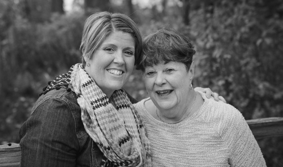 A black-and-white photo of Karin Stephenson and Dianne Stephenson smiling directly at the camera