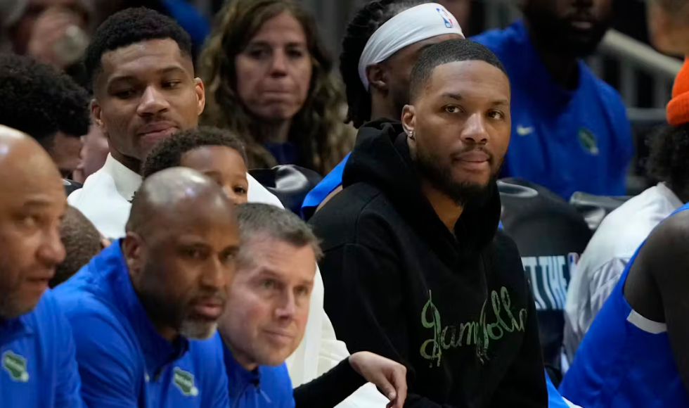 A crowd of a sports game watches.