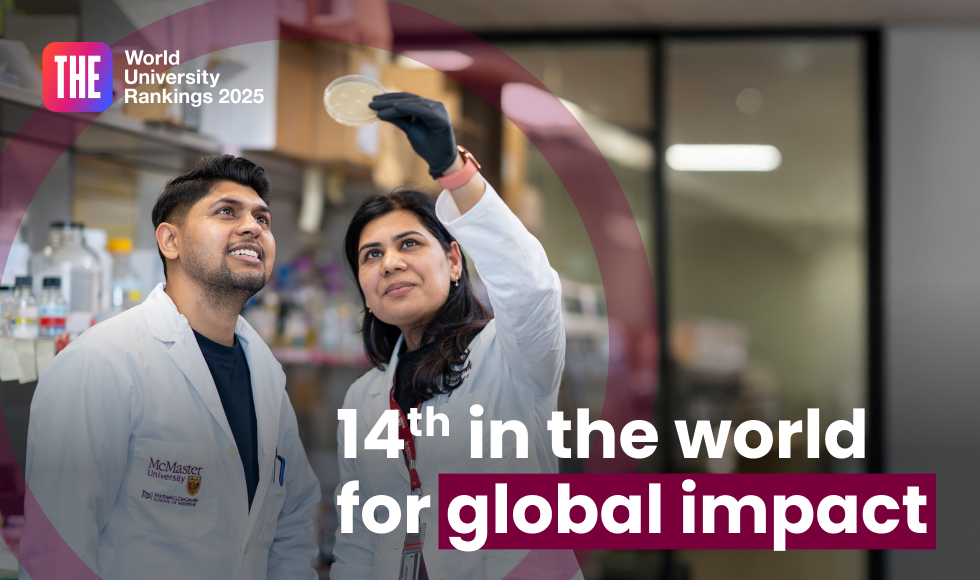 Two people in lab coats stand together, with one of them holding up a vial that both are looking at. Text on the photo reads '14th in the world for global impact.' In the top left corner is a logo with the text 'THE world university rankings 2025.'