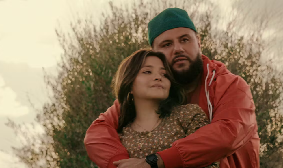 Two people embrace in a still image from Netflix's 'Mo.'